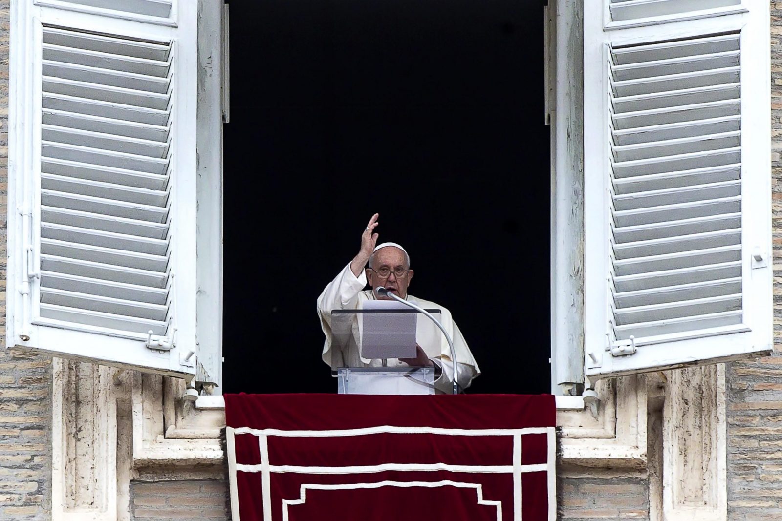 epa10952685 Pope Francis gestures as he leads the Angelus prayer from the window of his office overlooking Saint Peter's Square, in Vatican City, 01 November 2023, on the Solemnity of All Saints.  EPA/ANGELO CARCONI