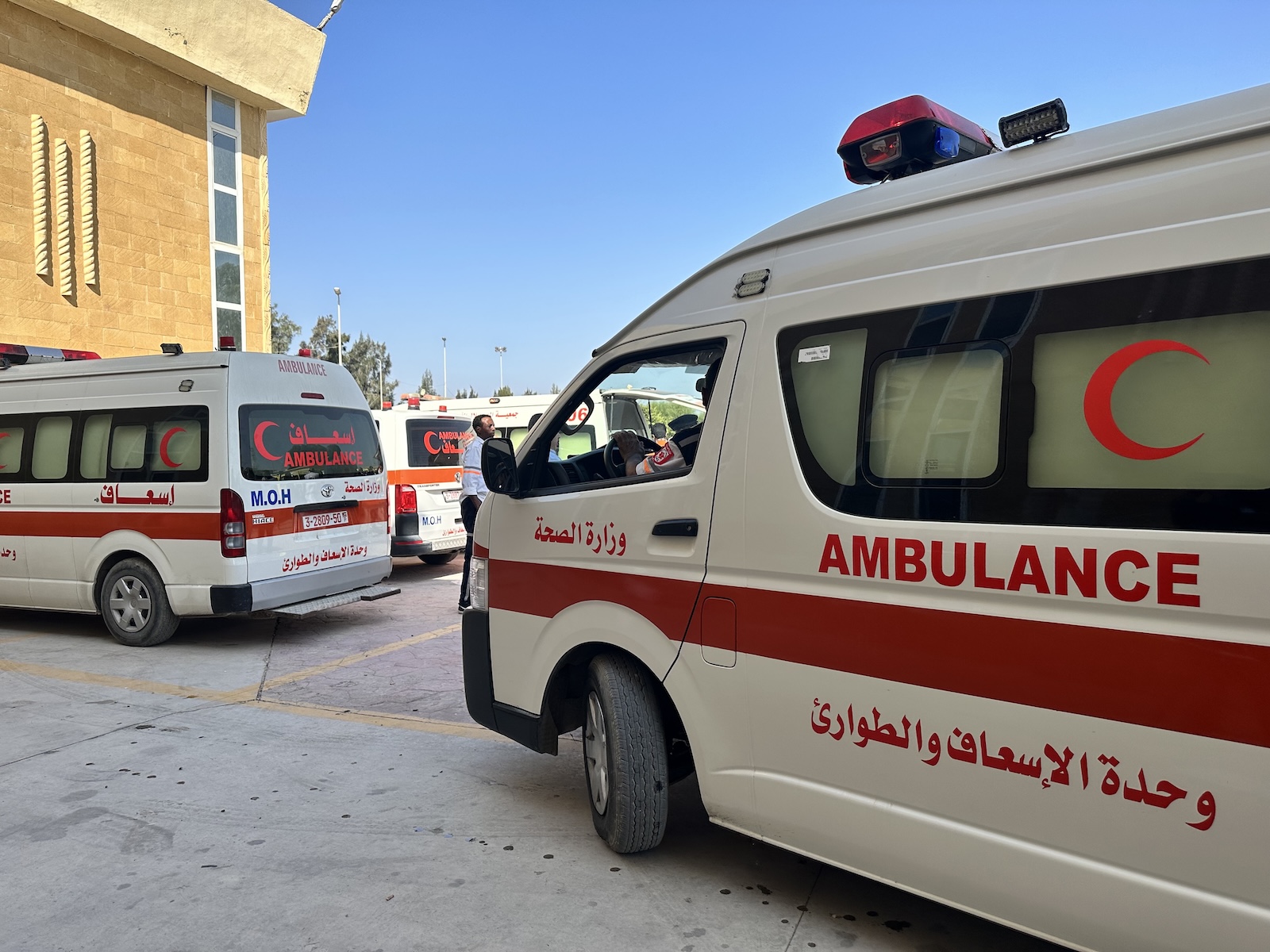 epa10956129 Ambulances cross the Rafah border crossing between the Gaza Strip and Egypt to bring injured people, in Rafah, Egypt, 03 November 2023. As per the agreement made by Egypt, Israel, and Hamas, a number of foreign nationals and individuals with critical injuries will be permitted to evacuate the besieged territory. More than 8,500 Palestinians and at least 1,400 Israelis have been killed, according to the Israel Defense Forces (IDF) and the Palestinian health authority, since Hamas militants launched an attack against Israel from the Gaza Strip on 07 October, and the Israeli operations in Gaza and the West Bank which followed it.  EPA/STRINGER