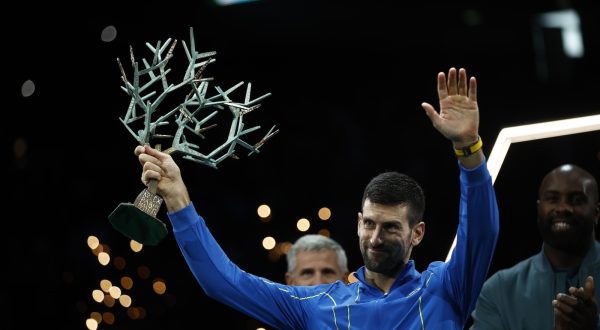 epa10959549 Novak Djokovic of Serbia poses with the trophy after winning his final match against Grigor Dimitrov of Bulgaria at the Paris Masters tennis tournament, in Paris, France, 05 November 2023.  EPA/YOAN VALAT