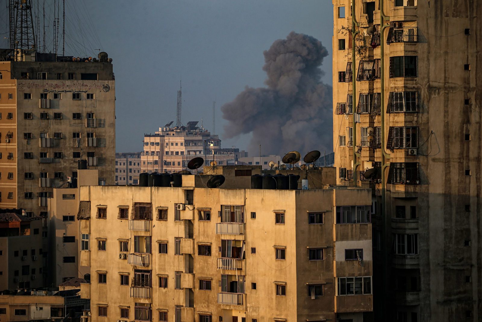 epa10963825 Smoke rises above residential buildings after an Israeli air strike amid combat between the Israeli army and militants of the Al-Qassam Brigades, the military wing of the Hamas movement, at the beach road in western Gaza City, 08 November 2023. More than 10,000 Palestinians and at least 1,400 Israelis have been killed, according to the Israel Defense Forces (IDF) and the Palestinian health authority, since Hamas militants launched an attack against Israel from the Gaza Strip on 07 October, and the Israeli operations in Gaza and the West Bank which followed it.  EPA/MOHAMMED SABER