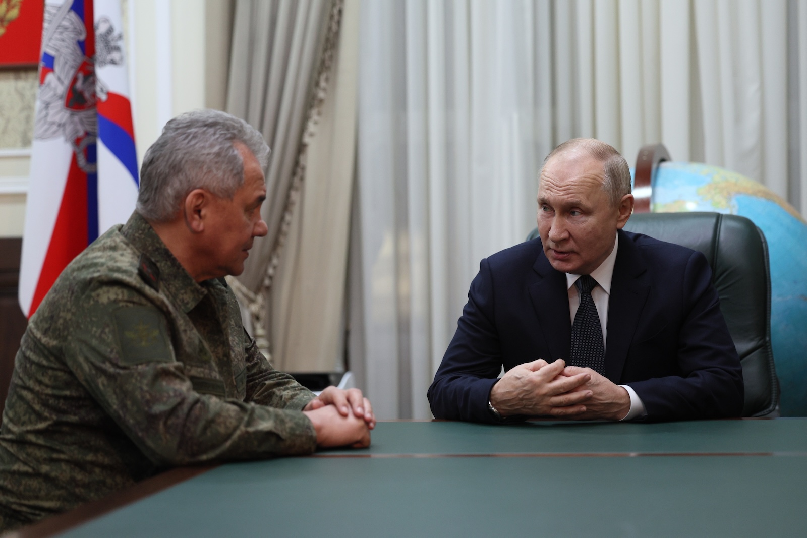 epa10967919 Russian President Vladimir Putin (R) and Defence Minister Sergei Shoigu attend a meeting at the headquarters of the group of forces taking part in the special military operation in Rostov-on-Don, Russia, late 09 November 2023 (issued 10 November 2023). On his way back from Kazakhstan, Vladimir Putin made a stopover in Rostov-on-Don, where he visited the headquarters of the Southern Military District and was briefed on the progress of the special military operation, shown new weapons samples of military hardware, presidential press secretary Dmitry Peskov said.  EPA/GAVRIIL GRIGOROV/SPUTNIK/KREMLIN POOL / POOL MANDATORY CREDIT
