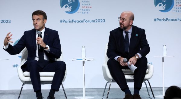 epa10968077 French President Emmanuel Macron (L) delivers a speech as European Council President Charles Michel listens during the opening ceremony of the 6th edition of the Paris Peace Forum at the Palais Brongniart in Paris, France, 10 November 2023. The annual Paris Peace Forum brings together governments, businesses, NGOs and others seeking dialogue to find solutions for global challenges. This year's theme is 'Seeking Common Ground in a World of Rivalry'.  EPA/STEPHANIE LECOCQ / POOL  MAXPPP OUT