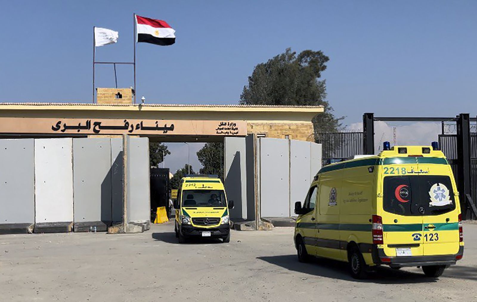 epa10968337 Ambulance cars pass the Rafah border crossing between the Gaza Strip and Egypt, in Rafah, Egypt, 10 November 2023. As per the agreement made by Egypt, Israel, and Hamas, a number of foreign nationals and individuals with critical injuries will be permitted to evacuate the besieged territory. More than 10,500 Palestinians and at least 1,400 Israelis have been killed, according to the Israel Defense Forces (IDF) and the Palestinian health authority, since Hamas militants launched an attack against Israel from the Gaza Strip on 07 October, and the Israeli operations in Gaza and the West Bank which followed it.  EPA/STR