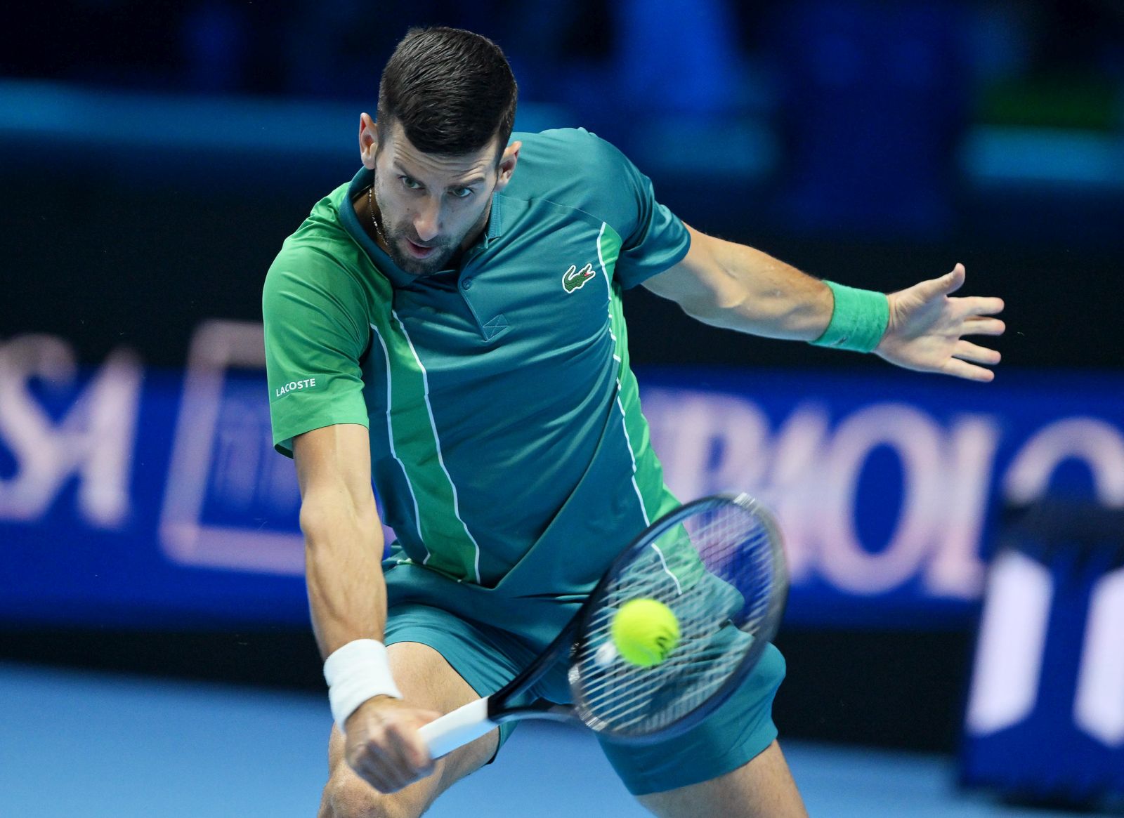 epa10972465 Novak Djokovic of Serbia in action during his singles match against Holger Rune of Denmark at the Nitto ATP Finals 2023 tennis tournament at the Pala Alpitour arena in Turin, Italy, 12 November 2023.  EPA/ALESSANDRO DI MARCO