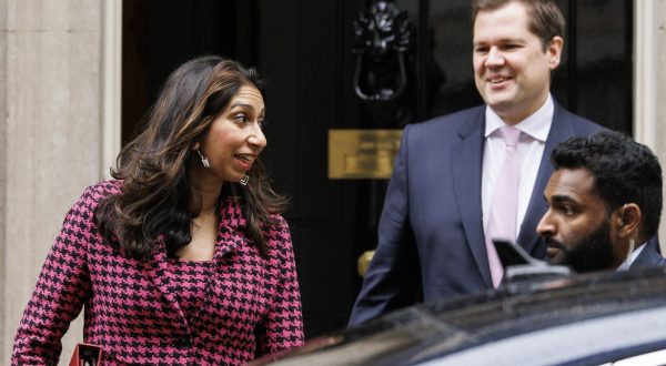 epa10935689 British Home Secretary Suella Braverman (L) and British Minister of State for Immigration Robert Jenrick leave Downing Street after a cabinet meeting in London, Britain, 24 October 2023. The UK Government is set to confirm some 50 hotel contracts to house migrants will be terminated by January 2024 in order to reduce the £8 million (EUR 9.2 million) a day cost for providing accommodation for housing asylum seekers.  EPA/TOLGA AKMEN