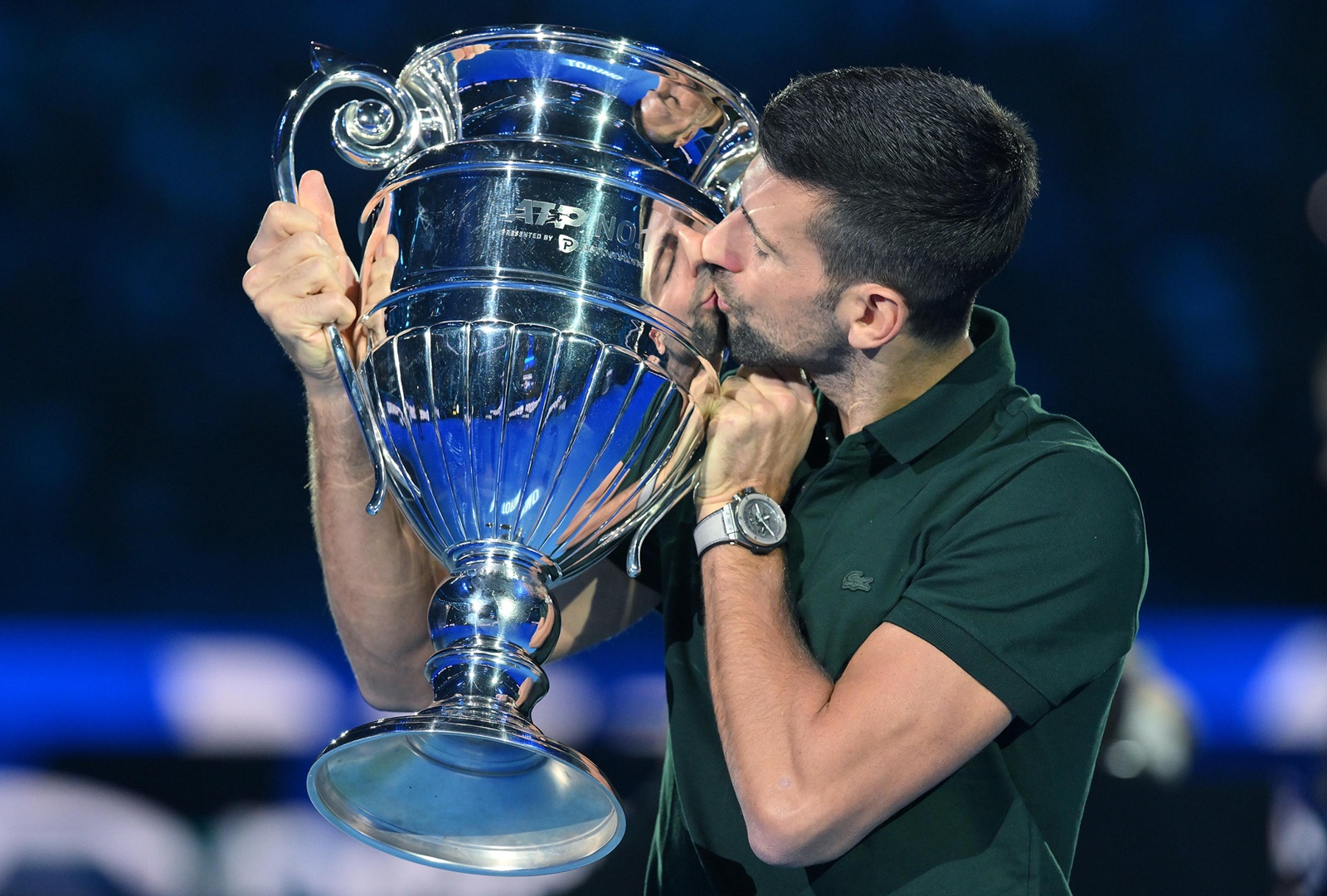 epa10973300 Novak Djokovic of Serbia poses with the trophy awarded for the ATP Year-End Number One in the world ranking, during the Nitto ATP Finals 2023 tennis tournament in Turin, Italy, 13 November 2023.  EPA/Alessandro Di Marco