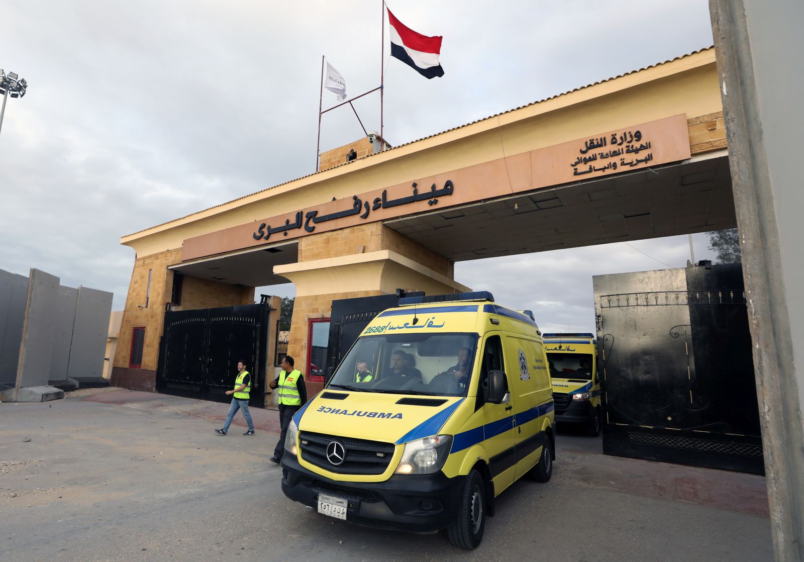 epa10985473 Ambulances cross the Rafah border crossing between the Gaza Strip and Egypt, in Rafah, Egypt, 19 November 2023. More than 11,700 Palestinians and at least 1,200 Israelis have been killed, according to the Israel Defense Forces (IDF) and the Palestinian health authority, since Hamas militants launched an attack against Israel from the Gaza Strip on 07 October, and the Israeli operations in Gaza and the West Bank which followed it.  EPA/KHALED ELFIQI