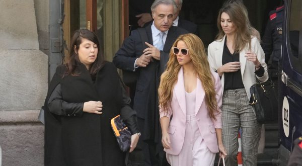 epa10985684 Colombian singer Shakira (C, in pink), accopanied by members of her defense team, leaves Barcelona Provincial Court on the first day of her trial for allegedly defrauding Spanish tax officials of 14.5 million euro in taxes between 2012 and 2014, in Barcelona city, Catalonia region, north-eastern Spain, 20 November 2023. Shakira has eventually secured a deal with Spanish prosecutors which means she avoids spending up to eight years in jail in exchange for paying a millionaire fine.  EPA/Quique Garcia