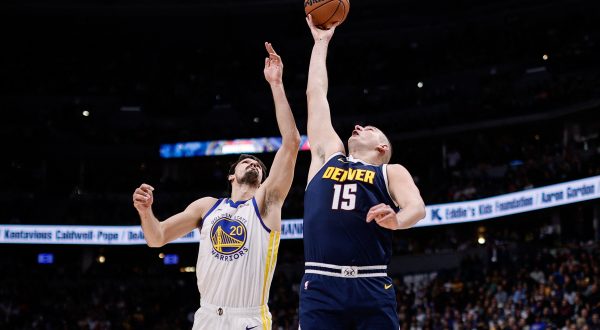 Nov 8, 2023; Denver, Colorado, USA; Denver Nuggets center Nikola Jokic (15) and Golden State Warriors forward Dario Saric (20) battle for a rebound in the first quarter at Ball Arena. Mandatory Credit: Isaiah J. Downing-USA TODAY Sports Photo: Isaiah J. Downing/REUTERS