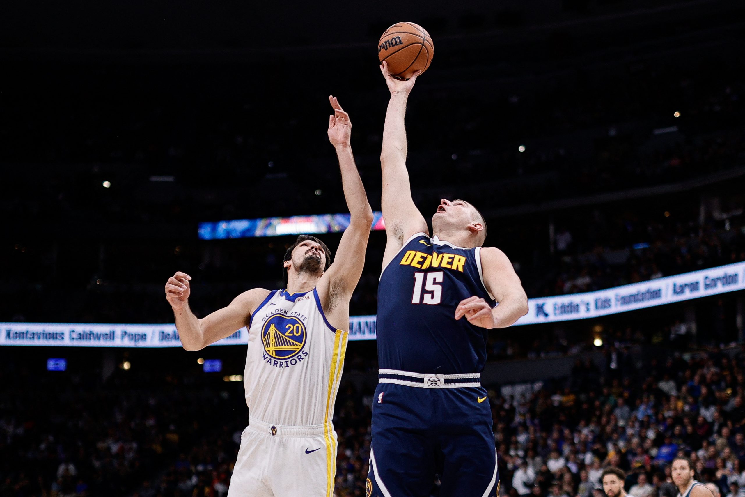 Nov 8, 2023; Denver, Colorado, USA; Denver Nuggets center Nikola Jokic (15) and Golden State Warriors forward Dario Saric (20) battle for a rebound in the first quarter at Ball Arena. Mandatory Credit: Isaiah J. Downing-USA TODAY Sports Photo: Isaiah J. Downing/REUTERS