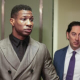 Jonathan Majors, left, enters a courtroom at the Manhattan criminal courts in New York, Monday, Dec. 18, 2023. The actor is accused of assaulting his then-girlfriend as the two struggled over a phone in the back seat of a chauffeured car. (AP Photo/Seth Wenig)