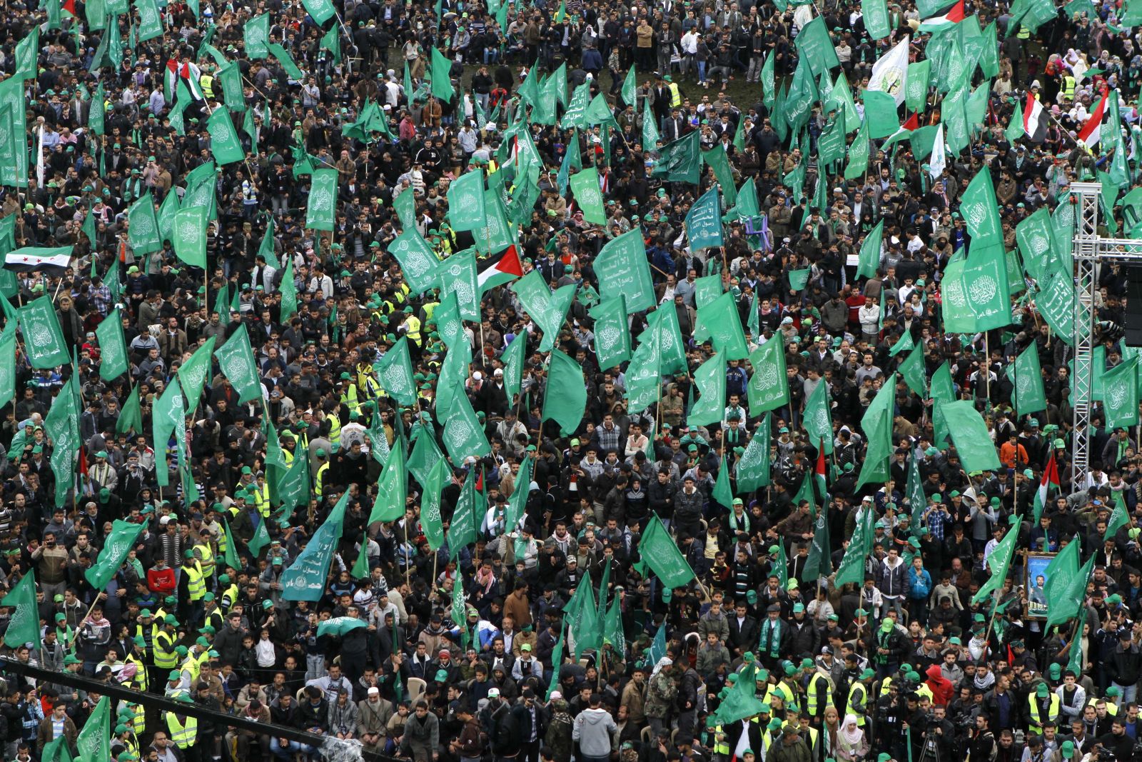 Palestinians Hamas supporters gather during a rally to commemorate the 25th anniversary of the Hamas militant group, in Gaza city, Saturday, Dec. 8, 2012. The Leader of the Islamic militant group Hamas vowed to continue fighting Israel Saturday as hundreds of thousands of flag-waving Gazans turned out for a mass rally to celebrate the 25th anniversary of the Hamas militant group, which has seen its clout and regional acceptance soar since last month's eight-day conflict with Israel. (AP Photo/Hatem Moussa)