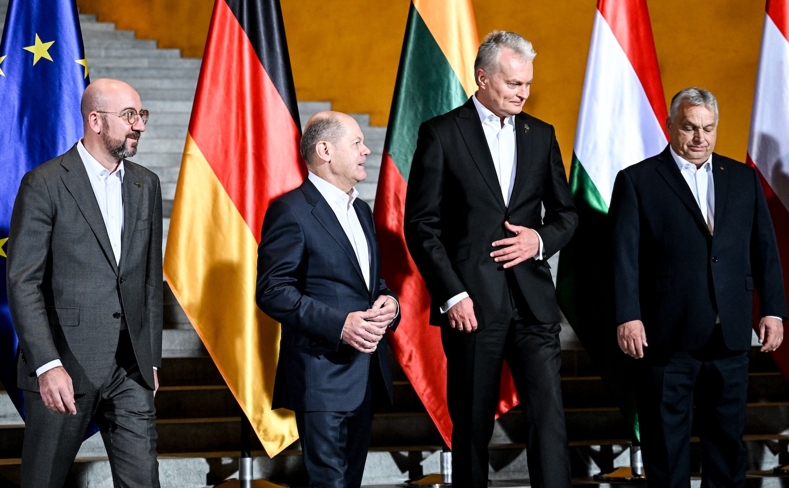 epa10973692 (L-R) European  Council President Charles Michel, German Chancellor Olaf Scholz and Lithuania's President Gitanas Nauseda, and Hungary's Prime Minister Viktor Orban talk after posing for a group photo at the chancellery in Berlin, Germany, 13 November 2023. German Chancellor Scholz received EU colleagues at the invitation of EU Council President Michel for a joint dinner to discuss reform measures related to the European Union's enlargement.  EPA/FILIP SINGER