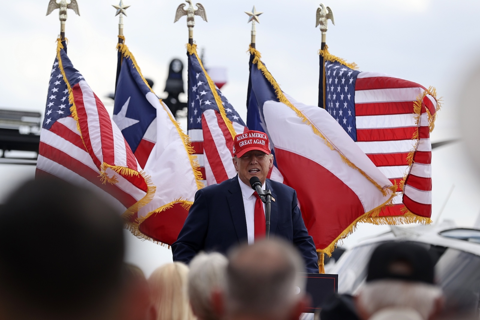 epa10985319 Former US president Donald Trump speaks at the South Texas International Airport in Edinburg, Texas, USA, 19 November 2023. This is another stop of Donald Trumps election campaign tour for presidency in 2024.  EPA/ADAM DAVIS