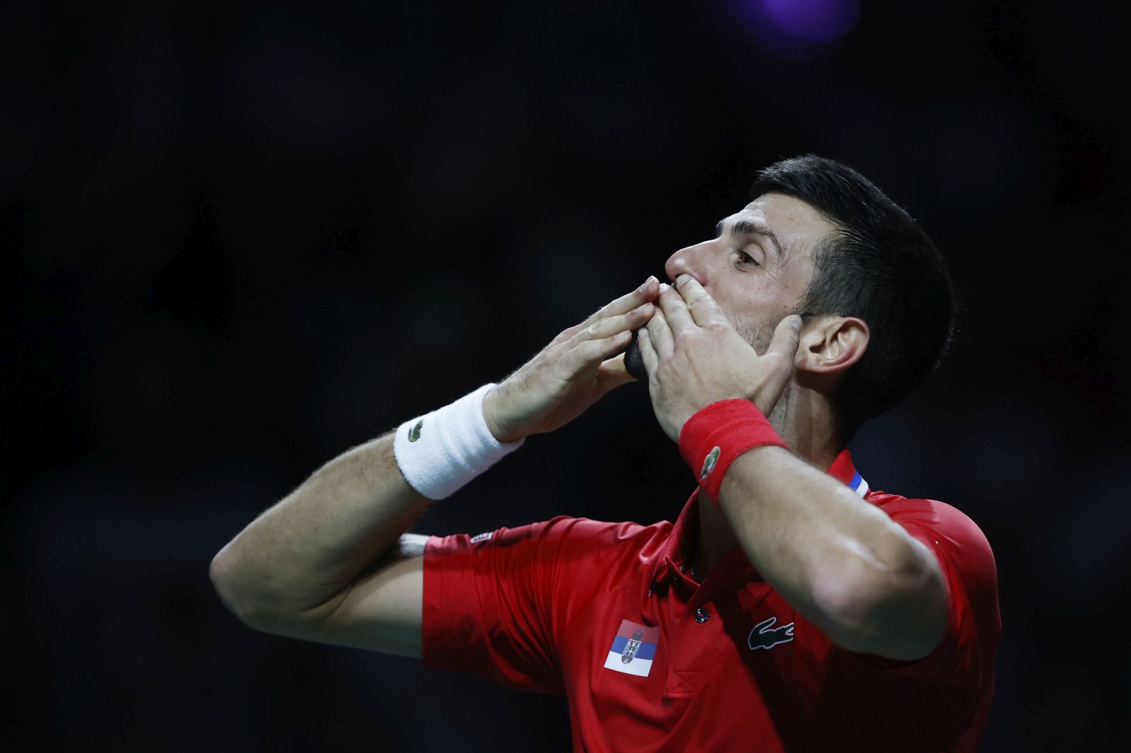 epa10991653 Novak Djokovic of Serbia celebrates his victory over Cameron Norrie of Great Britain in their singles match of the Davis Cup quarter final tie between Serbia and Great Britain in Malaga, Spain, 23 November 2023.  EPA/Jorge Zapata