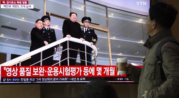 epa10997121 People watch as North Korean Leader Kim Jong Un appears on a TV monitor displaying daily news at a station in Seoul, South Korea, 27 November 2023. According to a statement by South Korean military officials made on 27 November, North Korea deployed troops and equipment to Demilitarized Zone (DMZ) ground posts after the North vowed to resume all military measures halted under a 2018 deal.  EPA/JEON HEON-KYUN