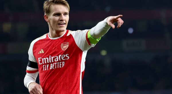 epa11002253 Martin Odegaard of Arsenal celebrates after scoring his team's 5th goal during the UEFA Champions League group B match between Arsenal and RC Lens in London, Britain, 29 November 2023.  EPA/ANDY RAIN
