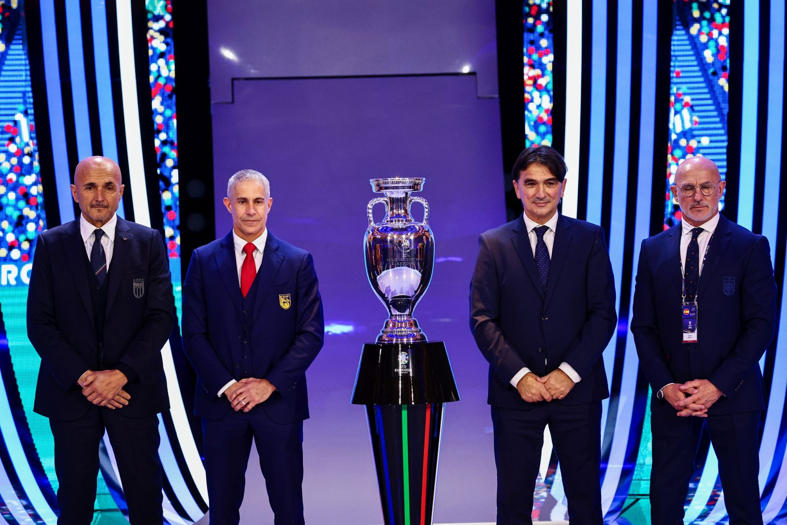 epa11007967 (L-R) Italy's head coach Luciano Spalletti, Albania's head coach Sylvinho, Croatia's head coach Zlatko Dalic and Spain's head coach Luis de la Fuente of Group B pose next to the trophy during the UEFA EURO 2024 final tournament draw at the Elbphilharmonie in Hamburg, Germany, 02 December 2023. The UEFA EURO 2024 will take place in Germany from 14 June to 14 July.  EPA/FILIP SINGER