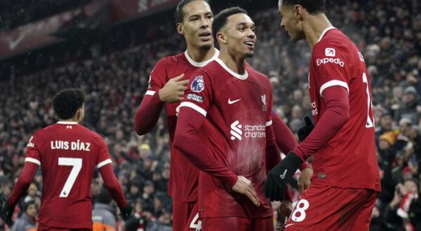 epa11009416 Trent Alexander-Arnold (2-R) of Liverpool celebrates with teammates Virgil van Dijk (2-L) and Cody Gakpo (R) after scoring the 4-3 leading goal during the English Premier League soccer match between Liverpool FC and Fulham FC, in Liverpool, Britain, 03 December 2023.  EPA/TIM KEETON EDITORIAL USE ONLY. No use with unauthorized audio, video, data, fixture lists, club/league logos, 'live' services or NFTs. Online in-match use limited to 120 images, no video emulation. No use in betting, games or single club/league/player publications.