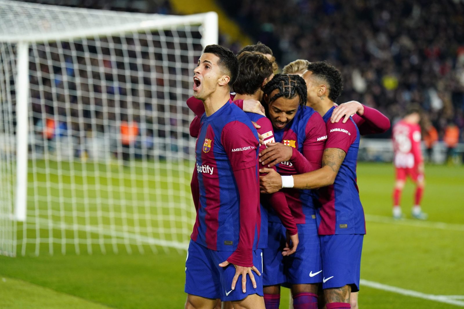 epa11009897 Barcelona's forward Joao Felix (2L) celebrates with teammates after scoring the 1-0 goal during the Spanish LaLiga soccer match between FC Barcelona and Atletico de Madrid, in Barcelona, Spain, 03 December 2023.  EPA/Siu Wu