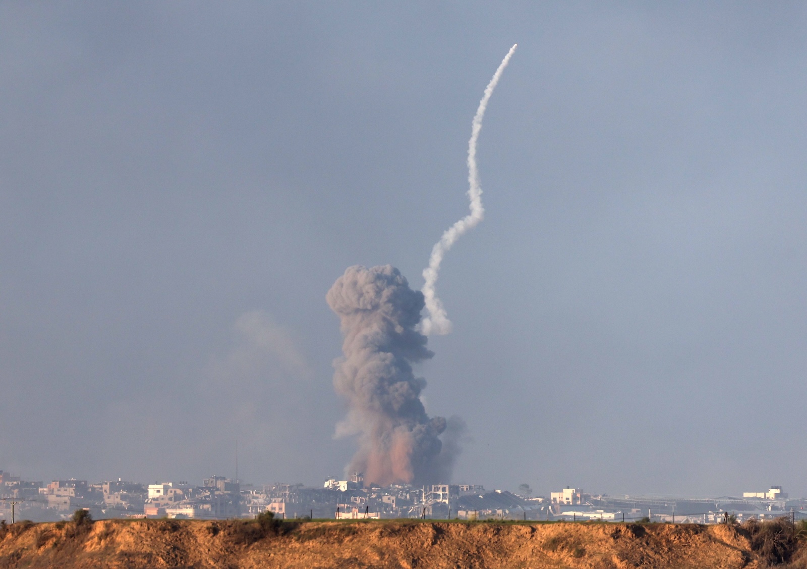 epaselect epa11013620 A missile is launched from southern Gaza as smoke rises following an Israeli strike, as seen from Beâ€™eri, Israel, 06 December 2023. Israeli forces resumed military strikes on Gaza after a week-long truce expired on 01 December. More than 16,000 Palestinians and at least 1,200 Israelis have been killed, according to the Palestinian Health Ministry and the Israel Defense Forces (IDF), since Hamas militants launched an attack against Israel from the Gaza Strip on 07 October, and the Israeli operations in Gaza and the West Bank which followed it.  EPA/ATEF SAFADI