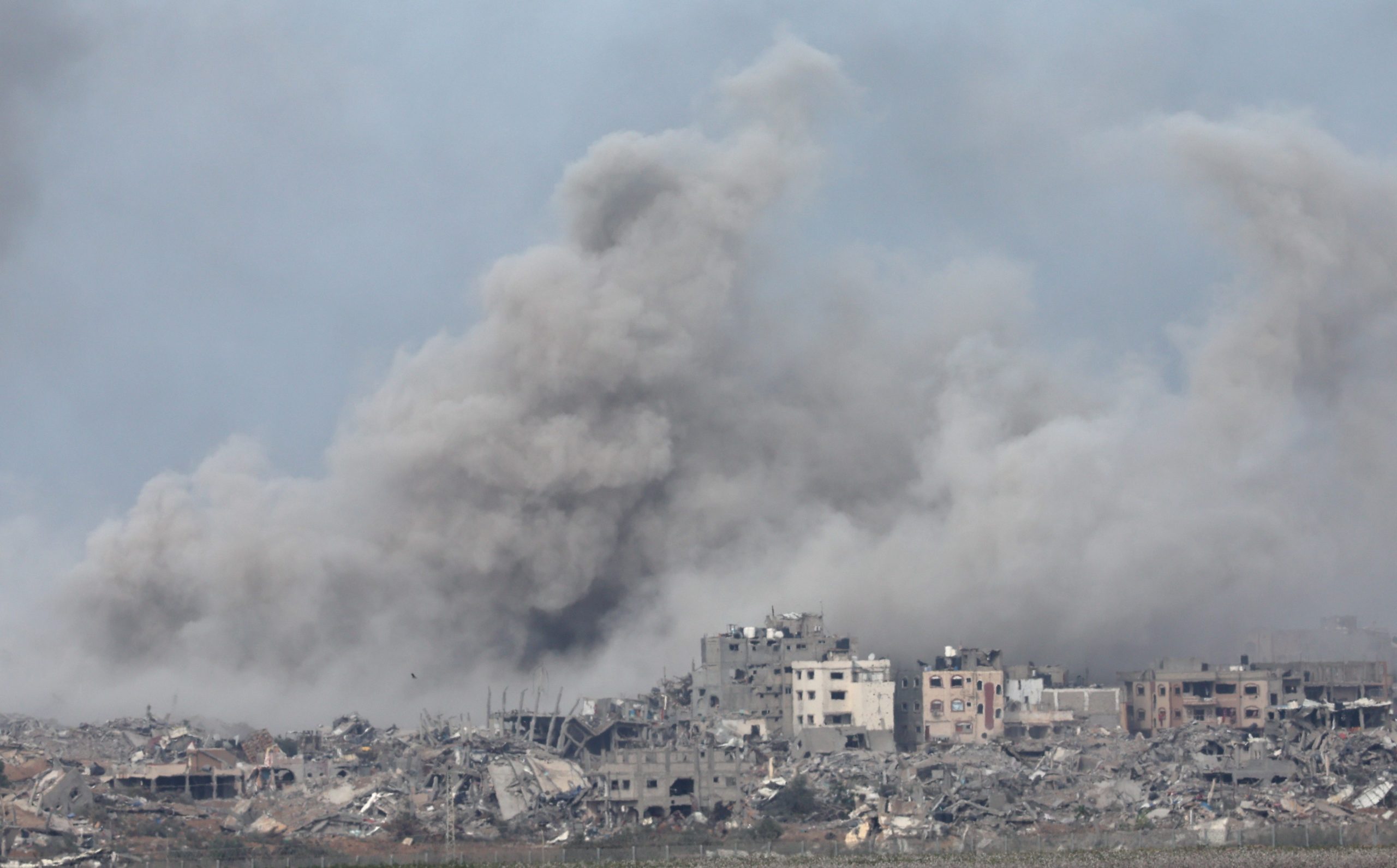 epa11018598 Smoke rises following an Isareli airstrike om Gaza's al-Shuja'ia district as seen from Nahal Oz, Israel, 09 December 2023. Israeli forces resumed military strikes on Gaza after a week-long truce expired on 01 December. More than 16,200 Palestinians and at least 1,200 Israelis have been killed, according to the Palestinian Health Ministry and the Israel Defense Forces (IDF), since Hamas militants launched an attack against Israel from the Gaza Strip on 07 October, and the Israeli operations in Gaza and the West Bank which followed it.  EPA/ATEF SAFADI