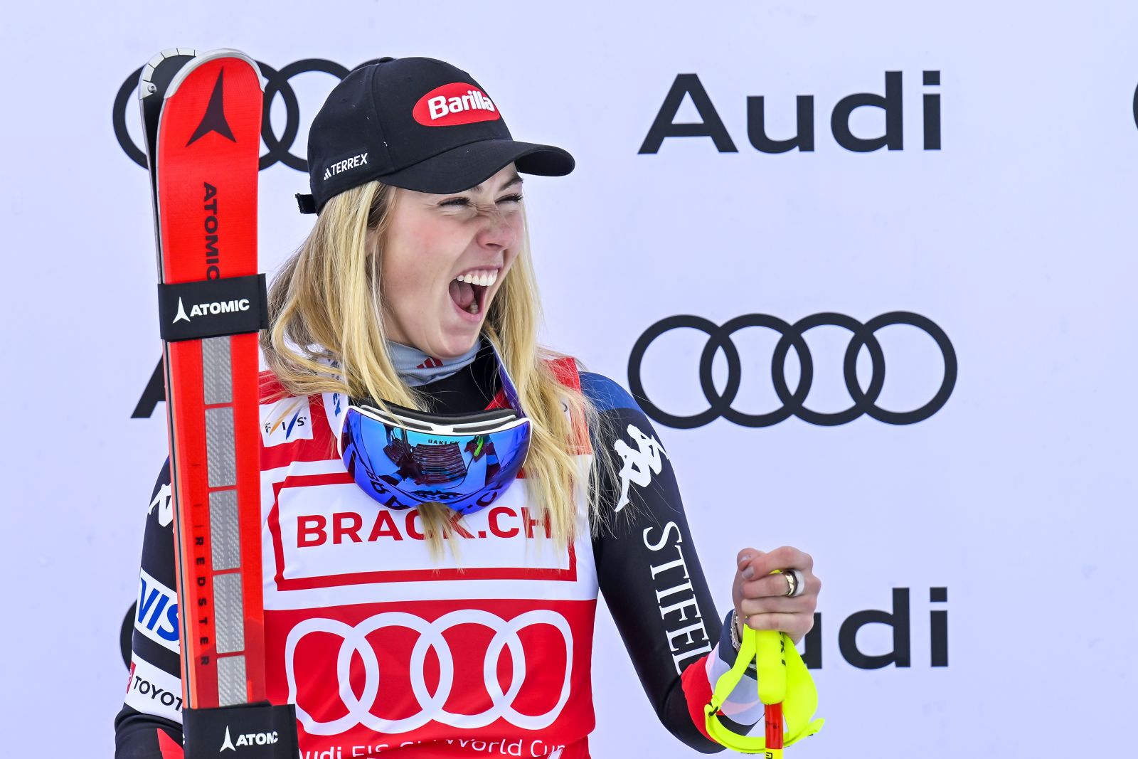 epa11018768 Winner Mikaela Shiffrin of USA celebrates on the podium for the Women Downhill race of the FIS Alpine Skiing World Cup in St. Moritz, Switzerland, 09 December 2023.  EPA/GIAN EHRENZELLER