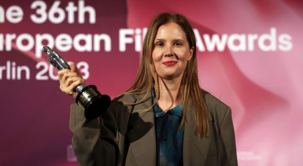 epa11020213 French Director Justine Triet poses with her European Director 2023 Award for 'Anatomy Of A Fall' during the 36th European Film Awards in the Arena Berlin in Berlin, Germany, 09 December 2023.  EPA/CLEMENS BILAN