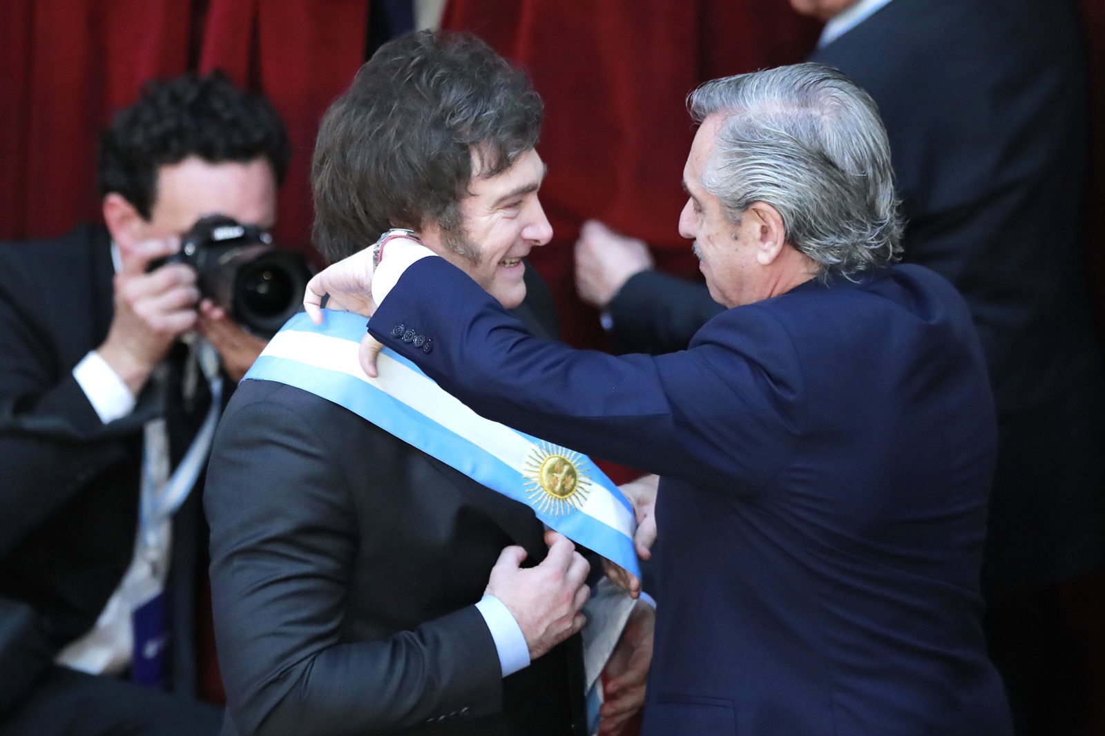 epa11021504 President of Argentina Javier Milei (L) receives the presidential sash from the outgoing President Alberto Fernandez, during the ceremony at the National Congress, Buenos Aires, Argentina, 10 December 2023. The far-right libertarian economist Milei will be sworn in at the National Congress to become president of the South American country for the period 2023-2027 after winning the runoff election on 19 November.  EPA/Demian Alday Estevez