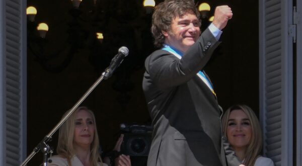 epa11022276 The president of Argentina, Javier Milei, gestures at the end of his speech on the balcony of the Casa Rosada in Buenos Aires, Argentina, 10 December 2023. Milei arrived at the Casa Rosada (seat of government) for the first time as head of state of the South American country, after taking the oath of office in Congress and delivering his speech to citizens. The leader of La Libertad Avanza (ultra-right) moved with his sister and main advisor, Karina Milei, in a convertible vehicle to the Plaza de Mayo, where, upon arriving at the Metropolitan Cathedral, he got out of the car and walked among the shouting of his followers.  EPA/Enrique García Medina