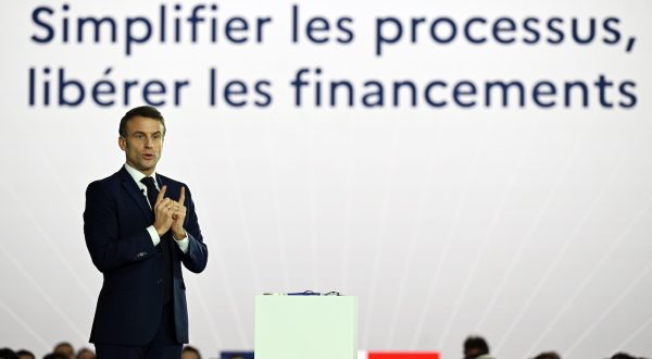 epa11023005 French President Emmanuel Macron delivers a speech as he visits Airbus site in Toulouse to follow up on France 2030 industrial investment plan, in Toulouse, France, 11 December 2023. The France 2030 plan was launched in October 2023 to increase France's competitiveness in key industrial and technological sectors.  EPA/Caroline Blumberg / POOL
