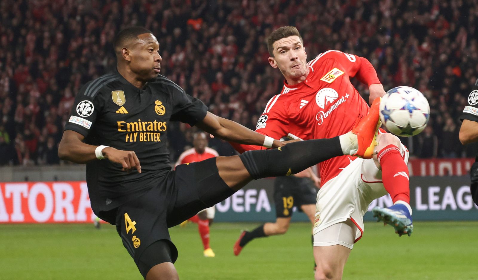 epa11025291 Madrid's David Alaba (L), Berlin's Robin Gosens (C) and Madrid's Lucas Vazquez (R) in action during the UEFA Champions League group stage match between Union Berlin and Real Madrid, in Berlin, Germany, 12 December 2023.  EPA/CLEMENS BILAN
