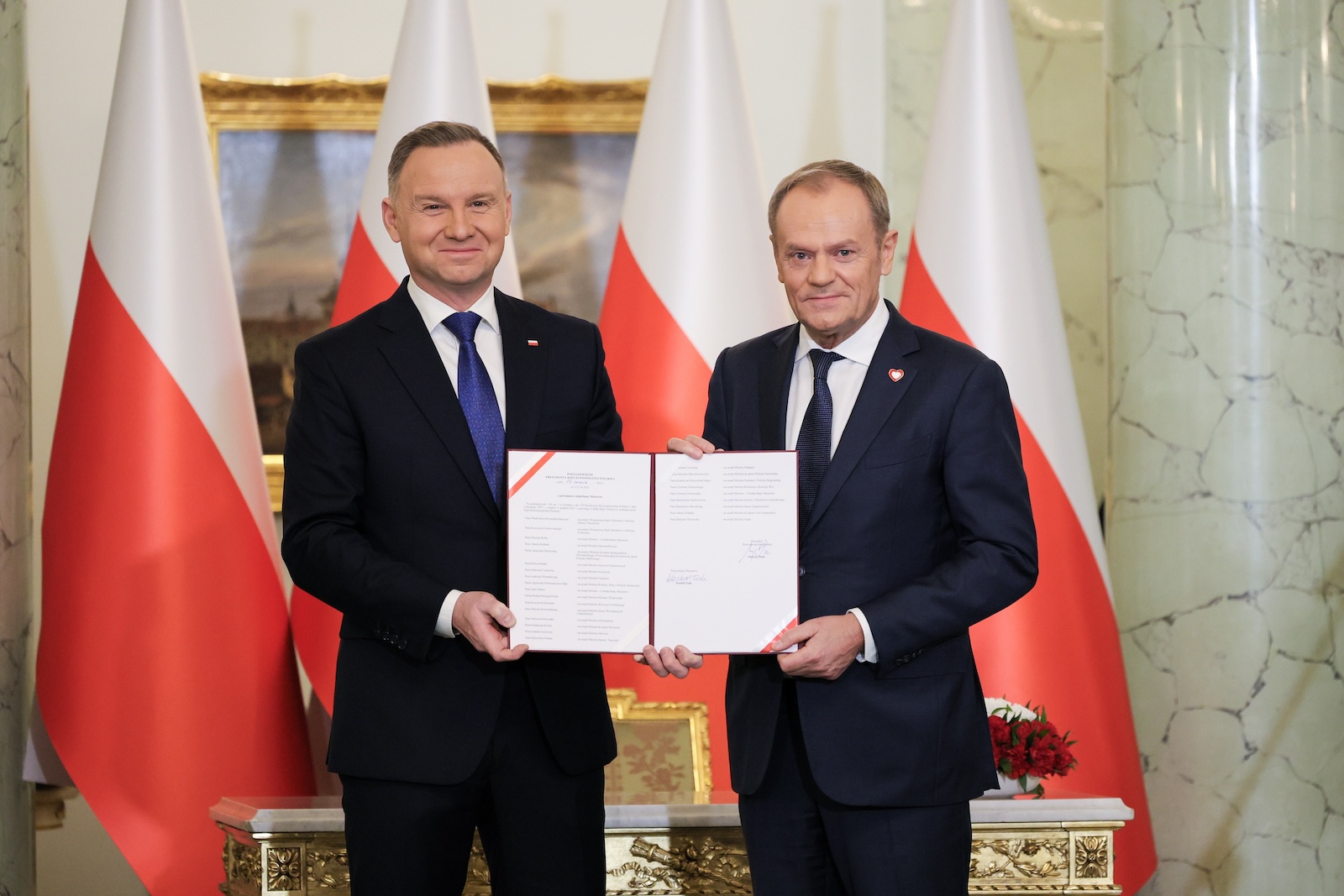 epa11025964 Poland's President Andrzej Duda (L) appoints Donald Tusk (R) for Polish Prime Minister in the new government during a ceremony at the  Presidential Palace in Warsaw, Poland, 13 December 2023.  EPA/PAWEL SUPERNAK POLAND OUT