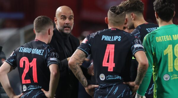 epa11027279 Manchester City's head coach Pep Guardiola (2-L) instructs his players during the UEFA Champions league group G soccer match between Red Star and Manchester City in Belgrade, Serbia, 13 December 2023.  EPA/ANDREJ CUKIC
