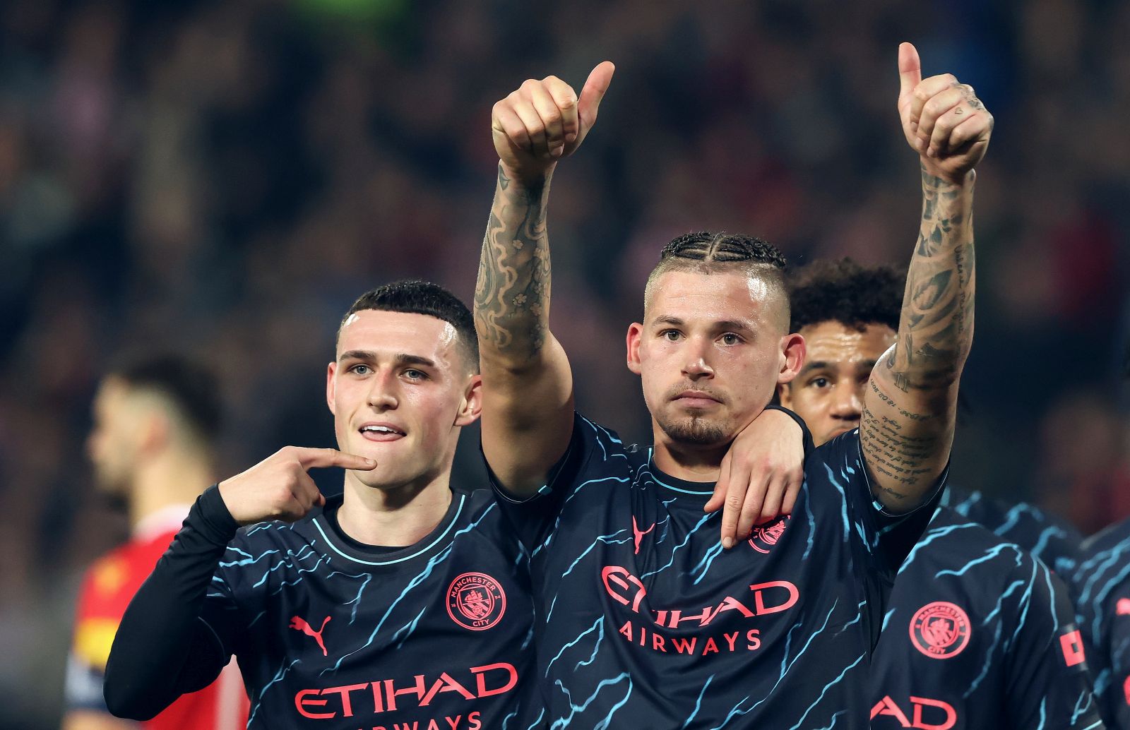 epa11027413 Manchester City's Kalvin Phillips celebrates with team-mate Phil Foden (L) after scoring the 1-3 goal during the UEFA Champions League group G soccer match between Red Star and Manchester City in Belgrade, Serbia, 13 December 2023.  EPA/ANDREJ CUKIC