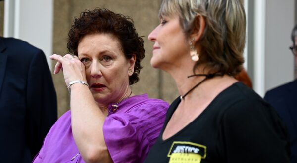 epa11027999 Kathleen Folbigg (L) wipes her eye as her friend Tracy Chapman (R) looks on after speaking to the media outside the New South Wales Court of Criminal Appeal in Sydney, Australia, 14 December 2023. Folbigg was jailed in 2003 and spent twenty years in prison after she was wrongly found guilty on three counts of murder and one of manslaughter following the deaths of her four children. Folbigg was pardoned and freed in June 2023 and has now had her convictions formally quashed.  EPA/DAN HIMBRECHTS  AUSTRALIA AND NEW ZEALAND OUT