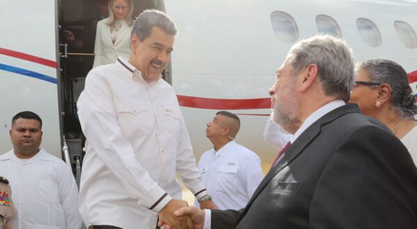 epa11029075 A handout photo made available by the Miraflores Press Office of Venezuelan President Nicolas Maduro (L) next to the Prime Minister of Saint Vincent and the Grenadines, Ralph Gonsalves (R), who received him after his arrival at the Airport Argyle International, serving the city of Kingstown, Saint Vincent and the Grenadines, 14 December 2023. The presidents of Venezuela, Nicolas Maduro, and Guyana, Irfaan Ali, will meet in Saint Vincent and the Grenadines to address the conflict generated by the territorial dispute between their respective governments over Guyana Essequiba, a territory of about 160,000 square kilometers that separates the two countries.  EPA/Miraflores Press Office HANDOUT ONLY AVAILABLE TO ILLUSTRATE THE ACCOMPANYING NEWS (MANDATORY CREDIT) HANDOUT EDITORIAL USE ONLY/NO SALES HANDOUT EDITORIAL USE ONLY/NO SALES