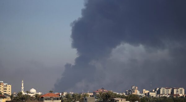 epa11035870 Smoke rises following Israeli air strikes in Gaza City, seen from Al Nusairat refugee camp, southern Gaza Strip, 18 December 2023. More than 60 members from two families were killed after an Israeli air strike, Palestinians civil defense said.  Israeli forces resumed military strikes on Gaza after a week-long truce expired on 01 December. More than 18,000 Palestinians and at least 1,200 Israelis have been killed, according to the Palestinian Health Ministry and the Israel Defense Forces (IDF), since Hamas militants launched an attack against Israel from the Gaza Strip on 07 October, and the Israeli operations in Gaza and the West Bank which followed it.  EPA/MOHAMMED SABER