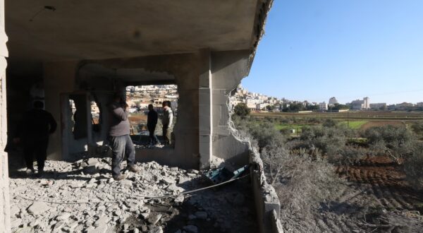 epa11036863 Palestinians inspect the destroyed home of Osama Bani Fadel in Aqraba village, south of the West Bank city of Nablus, 19 December 2023. The Israeli army demolished the house of Osama Bani Fadel, the alleged gunman named responsible for a shooting attack in Huwwara village near Nablus that killed two Israelis in August.  EPA/ALAA BADARNEH