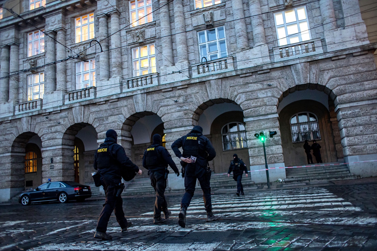 epa11040534 Police officers patrol following a mass shooting at one building of the Charles University in central Prague, Czech Republic, 22 December 2023. According to the Czech Police President Martin Vondrasek, there are at least 14 people dead and 25 injured after the shooting at the Charles University on 21 December. According to Czech police the perpetrator was a 24 year-old Charles University student, who is also suspected of killing his father.  EPA/MARTIN DIVISEK
