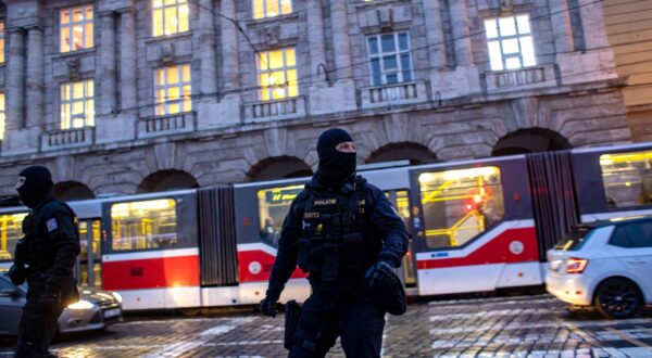 epa11040533 Police officers patrol following a mass shooting at one building of the Charles University in central Prague, Czech Republic, 22 December 2023. According to the Czech Police President Martin Vondrasek, there are at least 14 people dead and 25 injured after the shooting at the Charles University on 21 December. According to Czech police the perpetrator was a 24 year-old Charles University student, who is also suspected of killing his father.  EPA/MARTIN DIVISEK