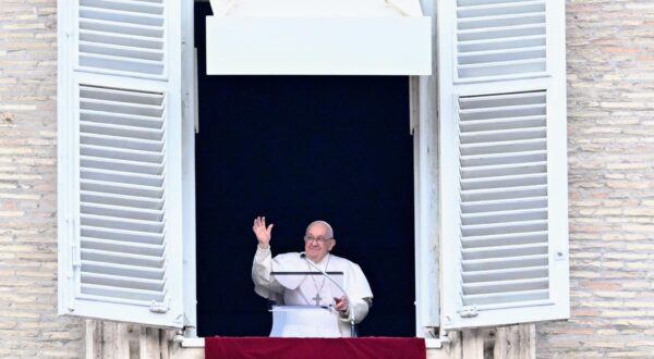 epa11044513 Pope Francis leads the Angelus prayer from his office window overlooking Saint Peter’s Square at the Vatican City, 26 December 2023.  EPA/CLAUDIO PERI