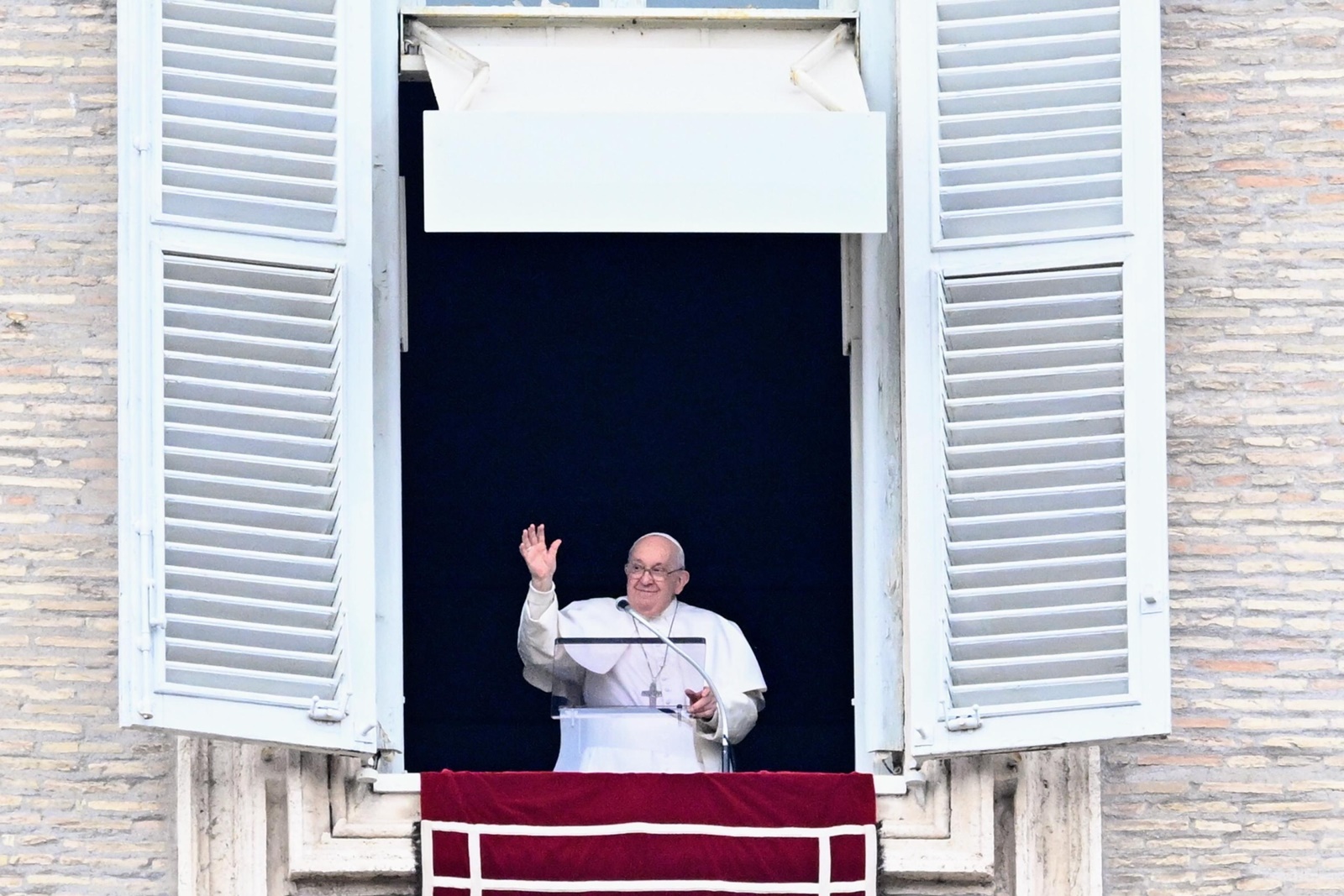epa11044513 Pope Francis leads the Angelus prayer from his office window overlooking Saint Peter’s Square at the Vatican City, 26 December 2023.  EPA/CLAUDIO PERI