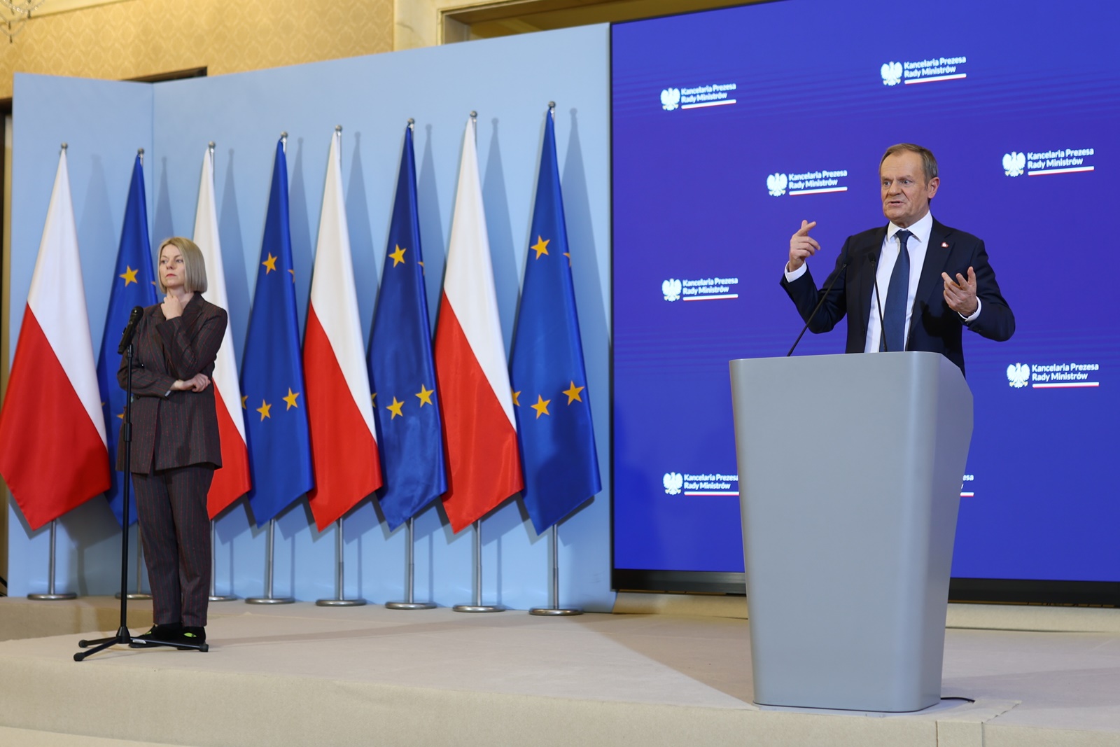 epa11045678 Polish Prime Minister Donald Tusk (R) speaks next to Agnieszka Rucinska (L) of the Civic Platform (PO) party press office, during a press conference after a meeting of the cabinet at the prime minister's office in Warsaw, Poland, 27 December 2023. The government will prepare a new budget-related bill 'after the president's veto', Donald Tusk announced at a press conference. Polish President Andrzej Duda vetoed the government's budget-related bill on 23 December, saying the veto was caused by 'a blatant violation of the Constitution and the principles of a democratic rule of law,' in reference to the government's sweeping management changes at state-owned media companies.  EPA/LESZEK SZYMANSKI POLAND OUT