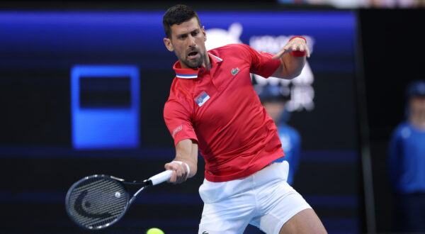 epa11050236 Novak Djokovic of Serbia in action against Zhizen Zhang of China during their group stage match of the 2024 United Cup  at RAC Arena in Perth, Australia, 31 December 2023.  EPA/RICHARD WAINWRIGHT  AUSTRALIA AND NEW ZEALAND OUT