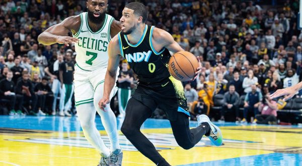 Dec 4, 2023; Indianapolis, Indiana, USA; Indiana Pacers guard Tyrese Haliburton (0) dribbles while Boston Celtics guard Jaylen Brown (7) defends in the second half at Gainbridge Fieldhouse. Mandatory Credit: Trevor Ruszkowski-USA TODAY Sports Photo: Trevor Ruszkowski/REUTERS