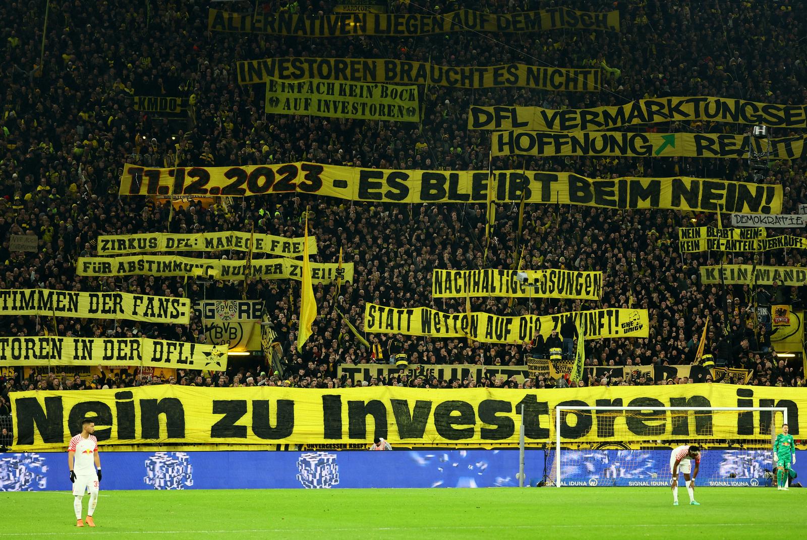 Soccer Football - Bundesliga - Borussia Dortmund v RB Leipzig - Signal Iduna Park, Dortmund, Germany - December 9, 2023 Borussia Dortmund fans display banners in the stands during the match REUTERS/Wolfgang Rattay DFL REGULATIONS PROHIBIT ANY USE OF PHOTOGRAPHS AS IMAGE SEQUENCES AND/OR QUASI-VIDEO. Photo: Wolfgang Rattay/REUTERS