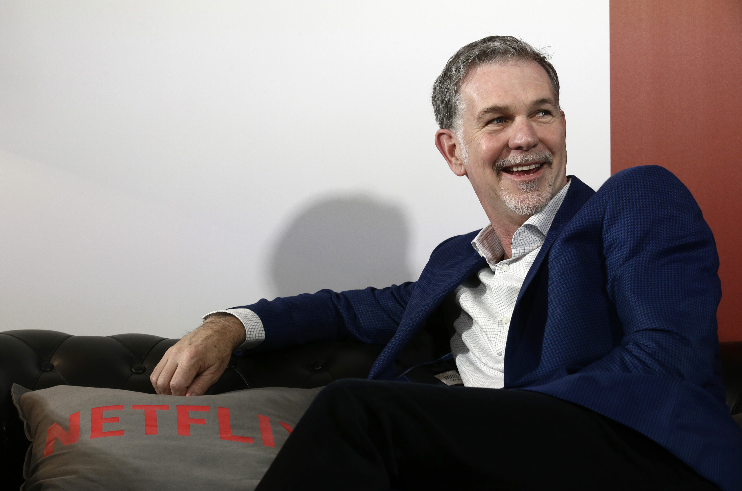 FILE - In this Feb. 28, 2017, file photo, Netflix Founder and CEO Reed Hastings smiles during an interview in Barcelona, Spain. Prominent charter school supporters are dishing out campaign money, as key gubernatorial races in several states have now begun in earnest. Hastings and philanthropist Laurene Powell Jobs donated $29,200 each, the maximum amount, to Democrat Gavin Newsom's campaign for California governor. (AP Photo/Manu Fernandez, File)
