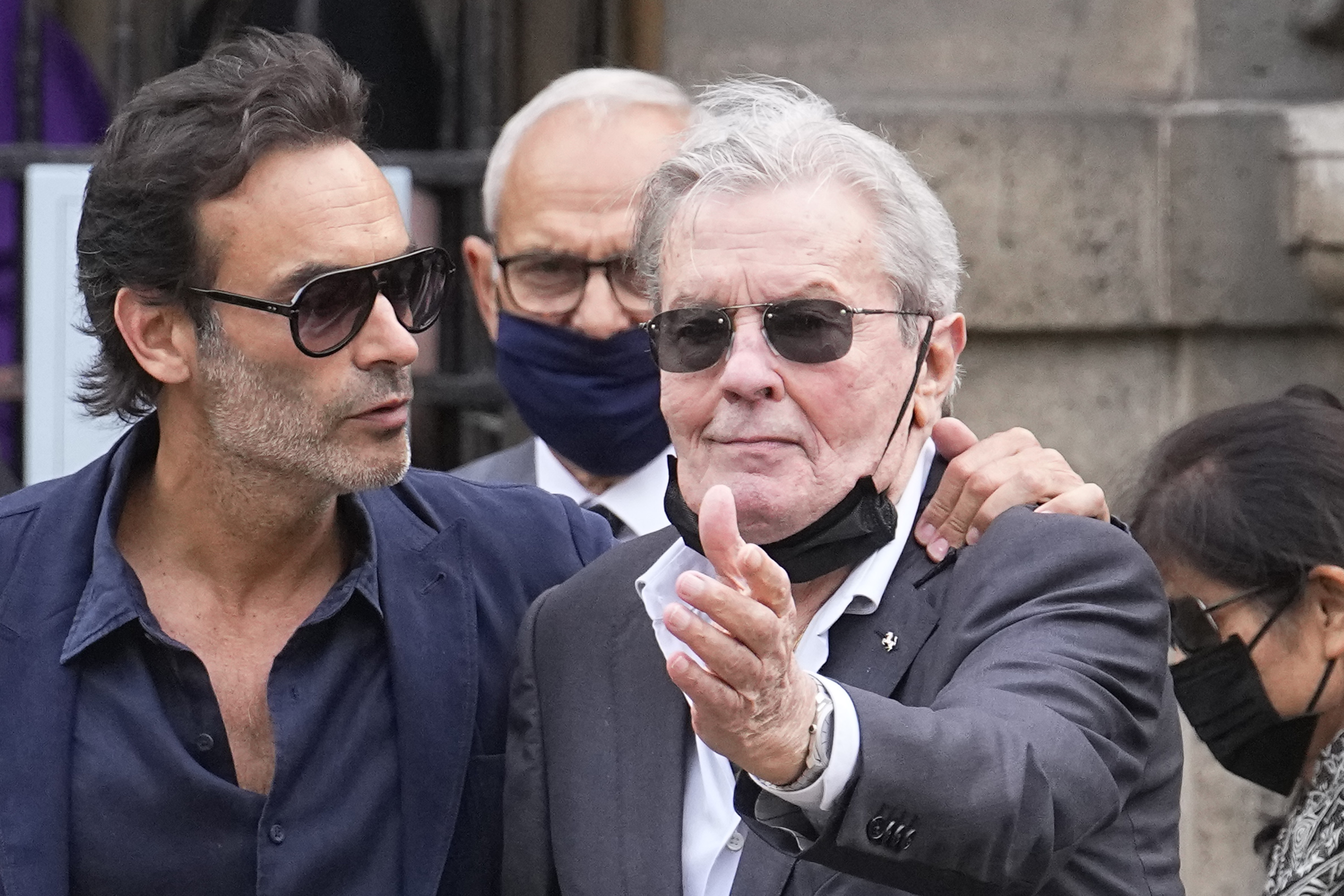 French actor Alain Delon and his son Anthony Delon, left, arrive at the Saint Germain des Près church to attend Jean-Paul Belmondo's funeral service, Friday, Sept. 10, 2021 in Paris. The star of the iconic French New Wave film "Breathless" died Monday aged 88. (AP Photo/Michel Euler)