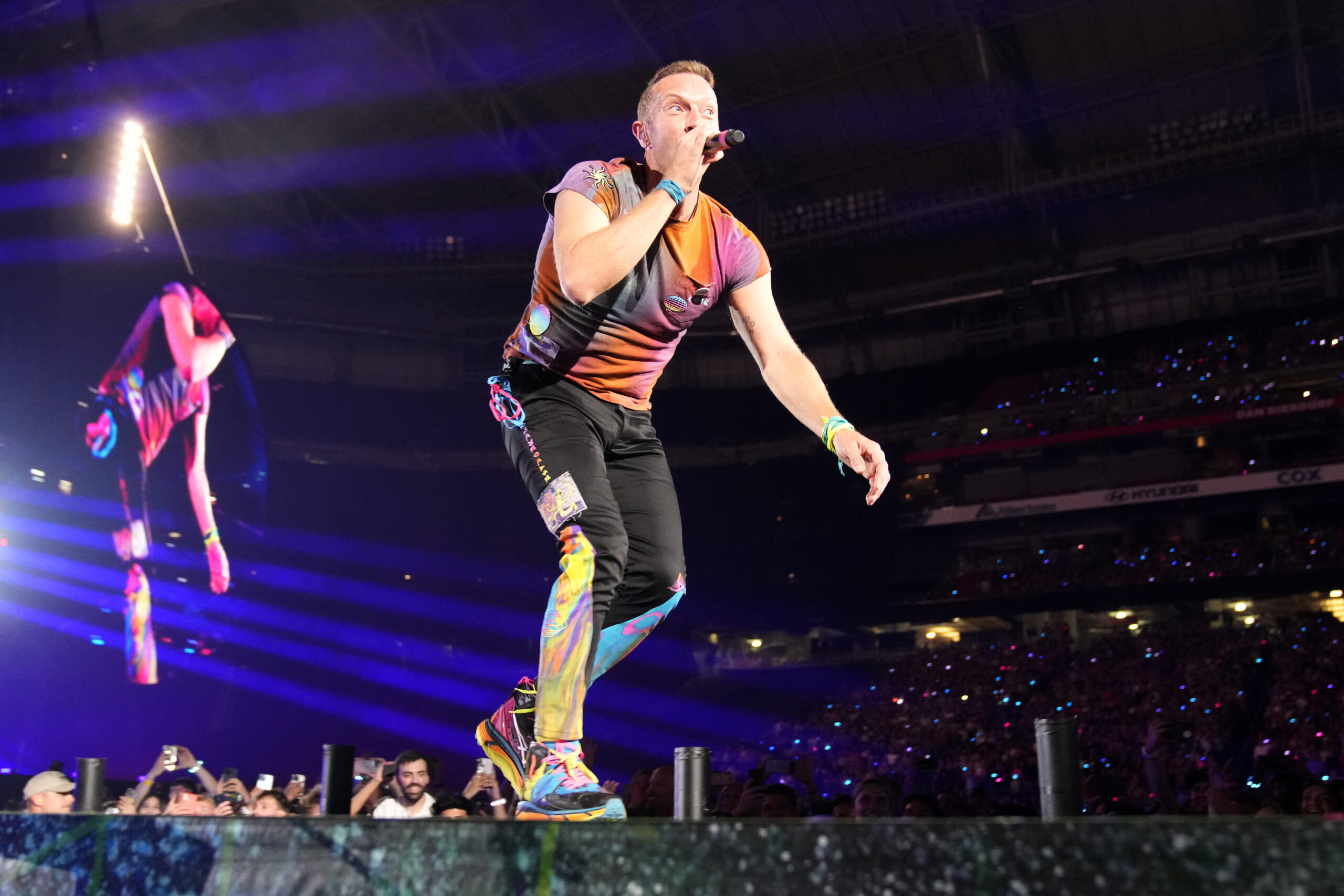 Chris Martin of Coldplay performs during the band's Music of the Spheres world tour on Thursday, May 12, 2022, at State Farm Stadium in Glendale, Ariz. (Photo by Rick Scuteri/Invision/AP)
